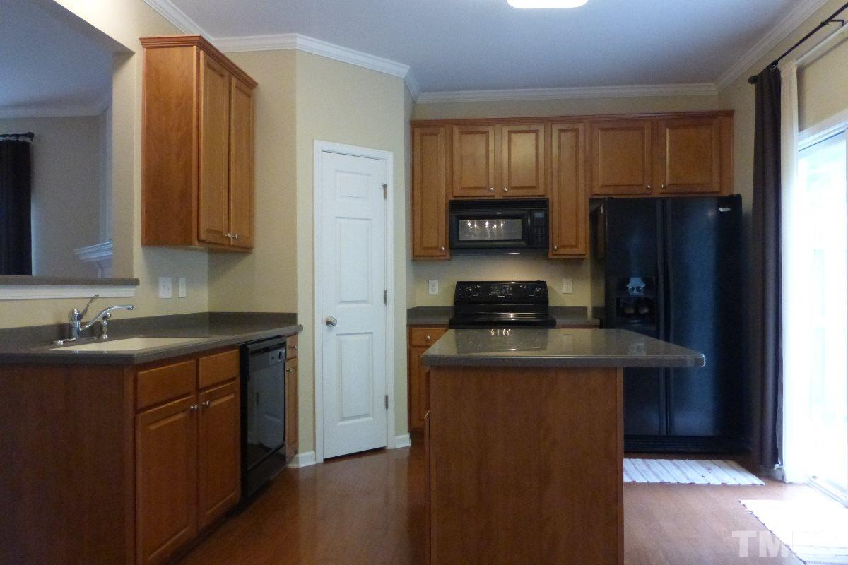 3003 Winding Waters Way Raleigh, NC 27614 - Photo 8 of 17 The modern kitchen includes refrigerator and microwave that will convey, Ditto the clothes washer and dryer.