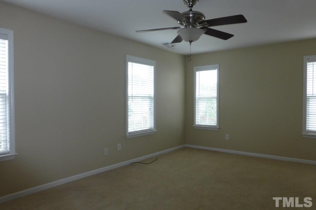 3003 Winding Waters Way Raleigh, NC 27614 - Photo 10 of 17 Retire upstairs to the big and bright (4 windows) master suite with tub, shower, double vanities and walk-in closet.