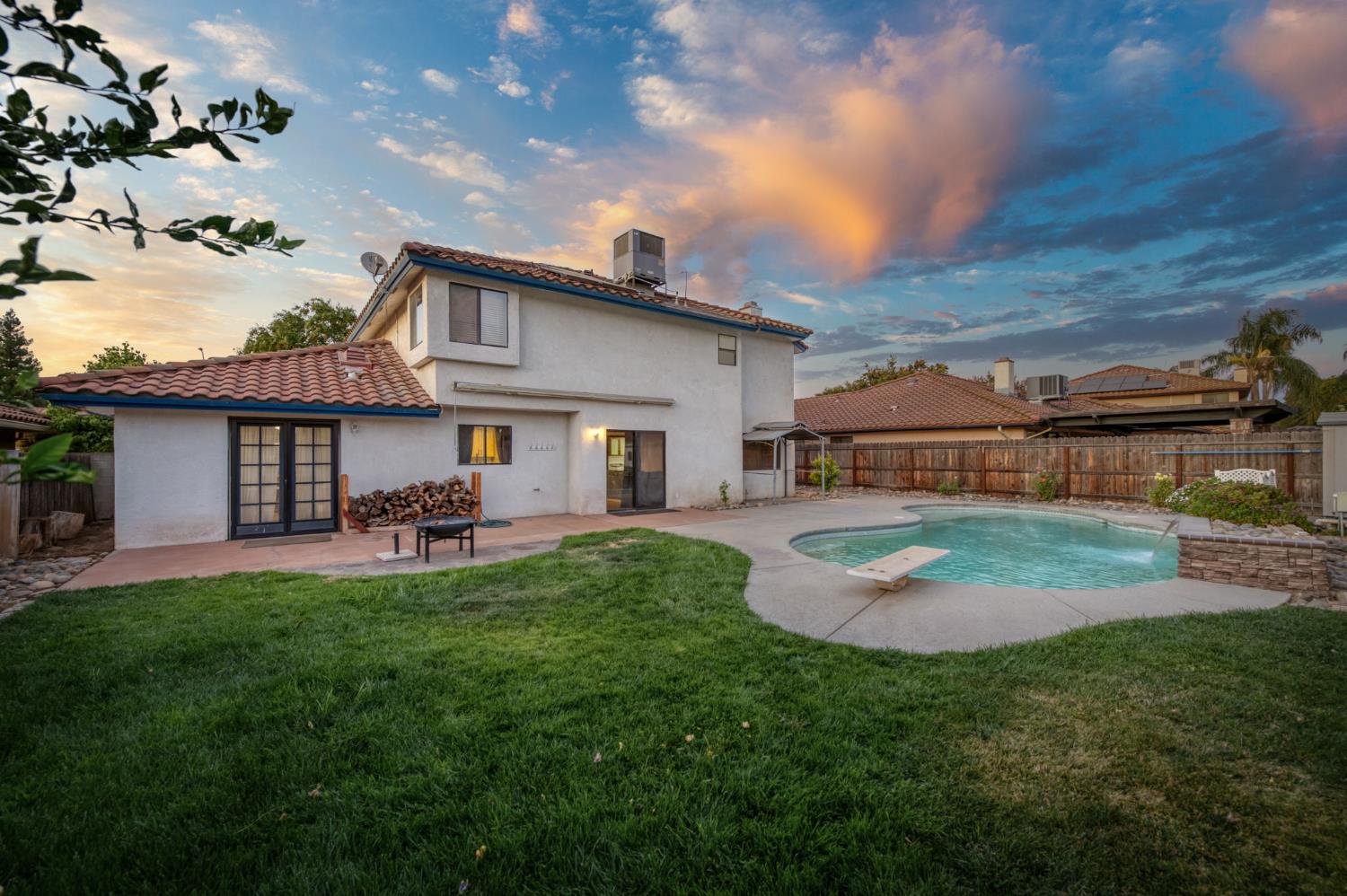 a view of a house with a yard porch and sitting area