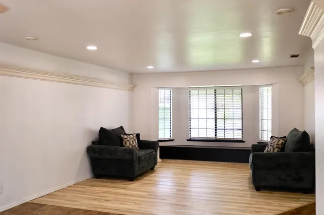 a dining room with furniture and window