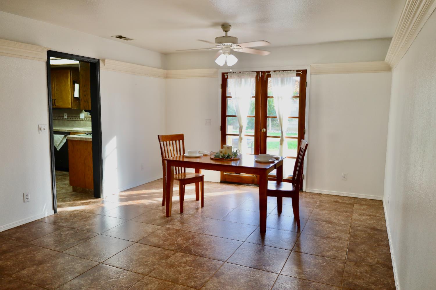3040 Boulder Avenue Madera, CA 93637 - Photo 13 of 50 a dining room with furniture and window