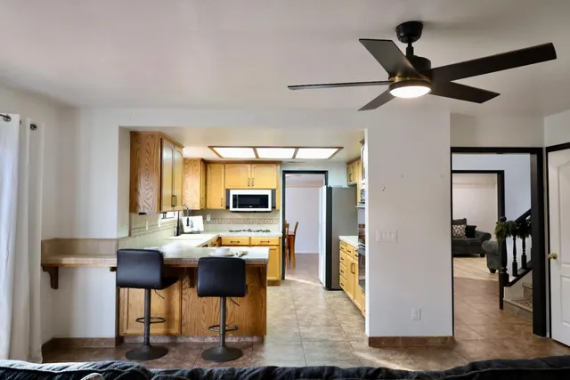 a living room with furniture fireplace and window