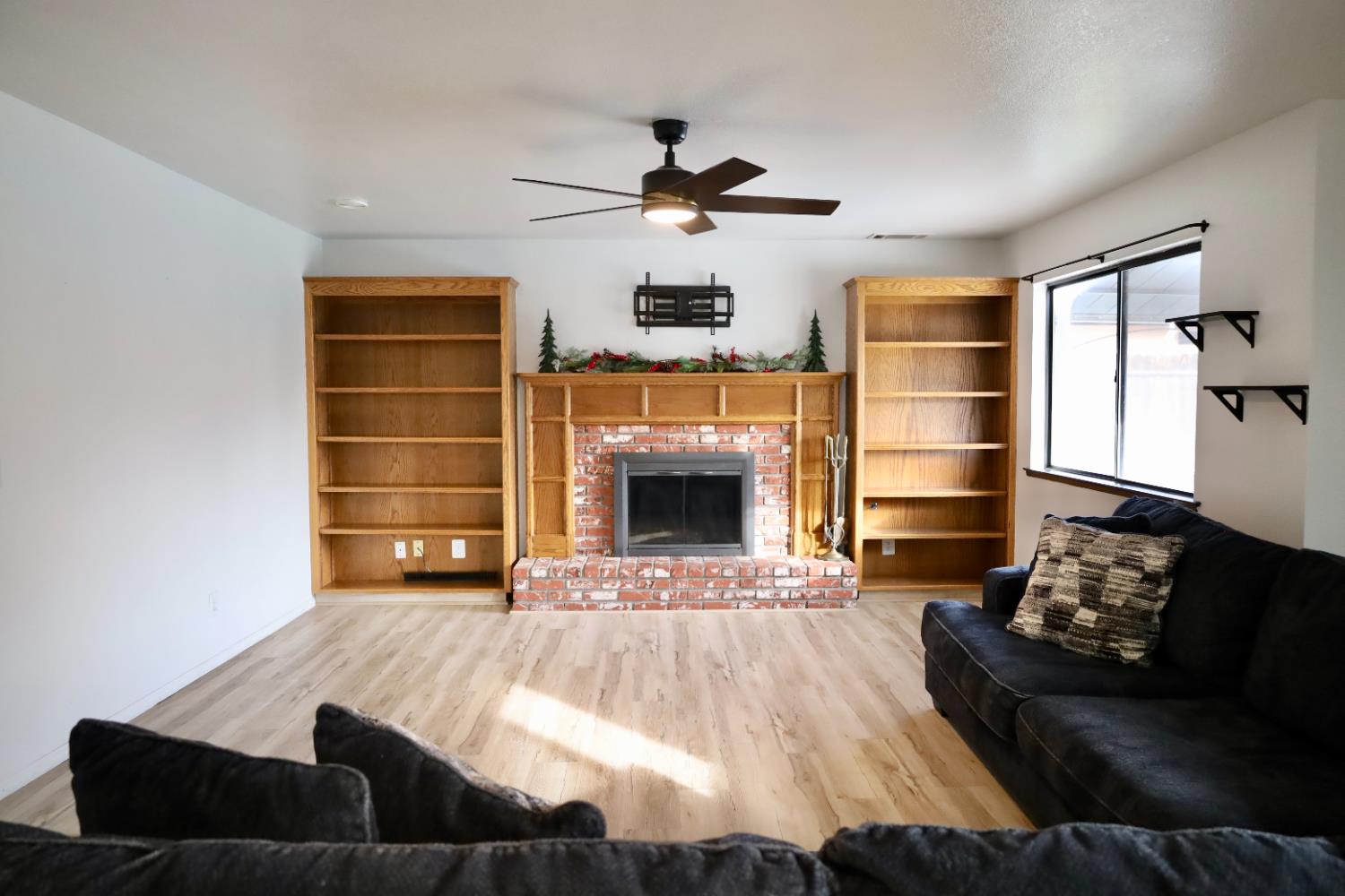 3040 Boulder Avenue Madera, CA 93637 - Photo 19 of 50 a living room with furniture fireplace and window