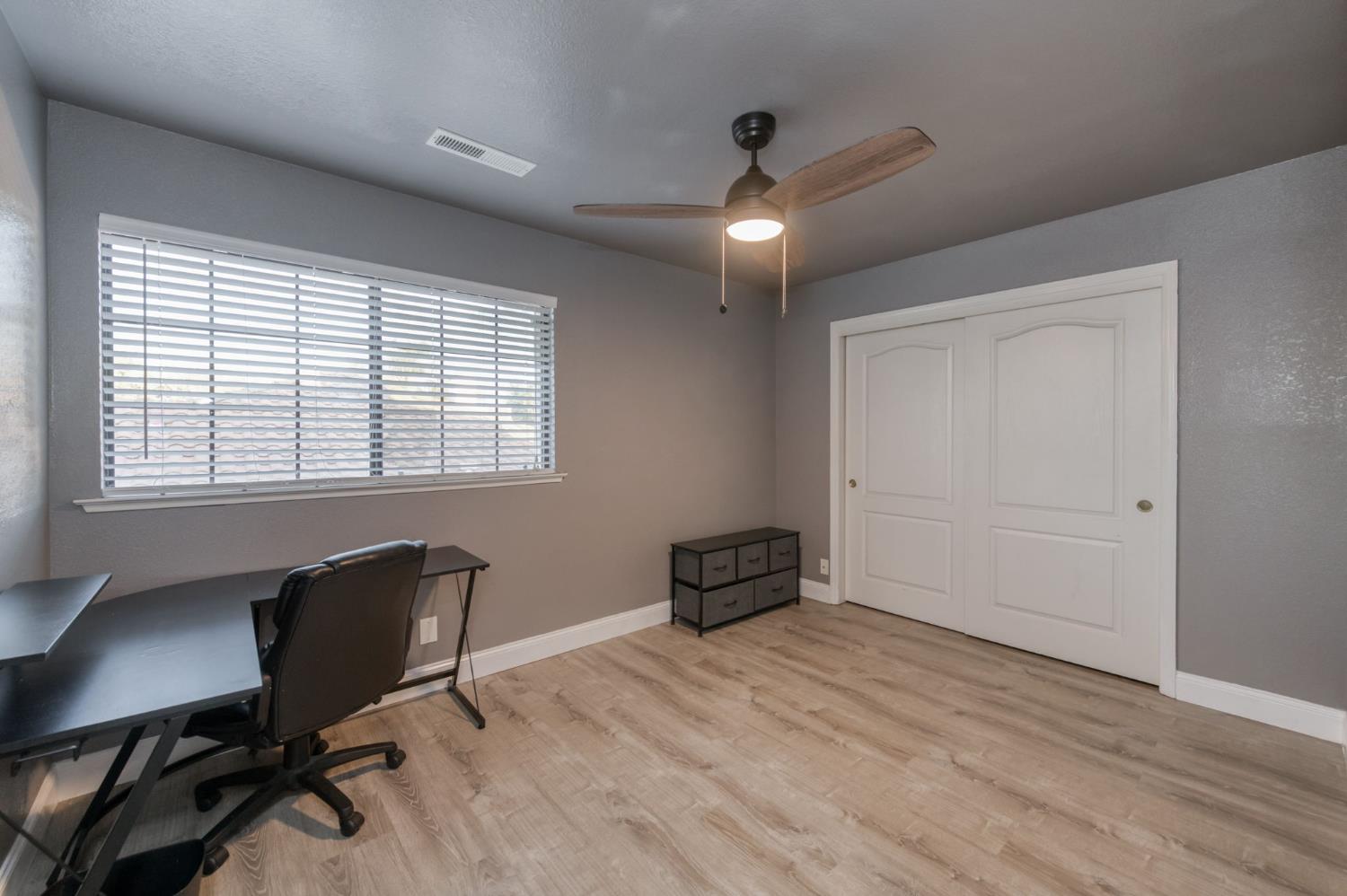 3040 Boulder Avenue Madera, CA 93637 - Photo 30 of 50 a view of workspace with furniture and a window