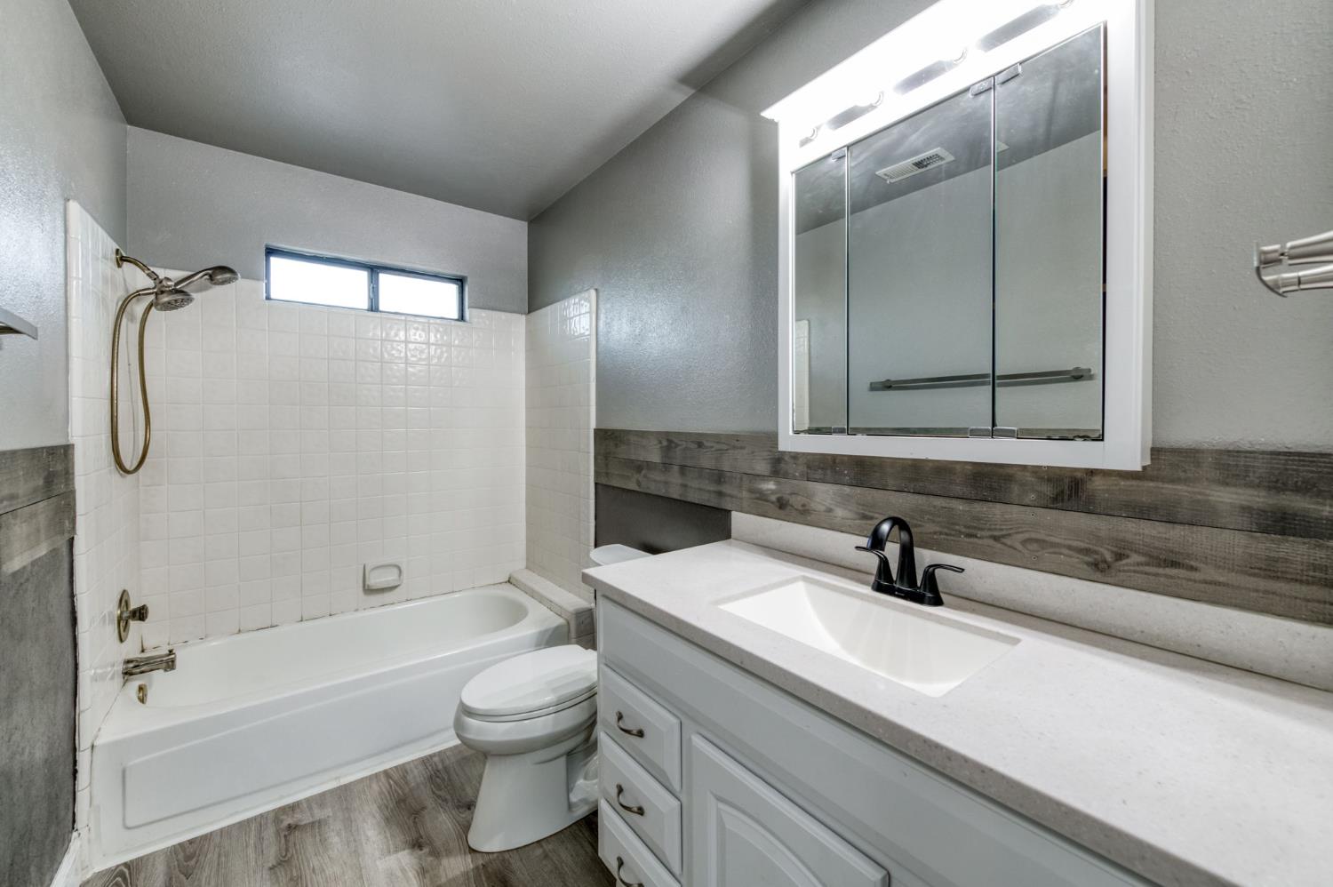 3040 Boulder Avenue Madera, CA 93637 - Photo 31 of 50 a bathroom with a sink a toilet and shower