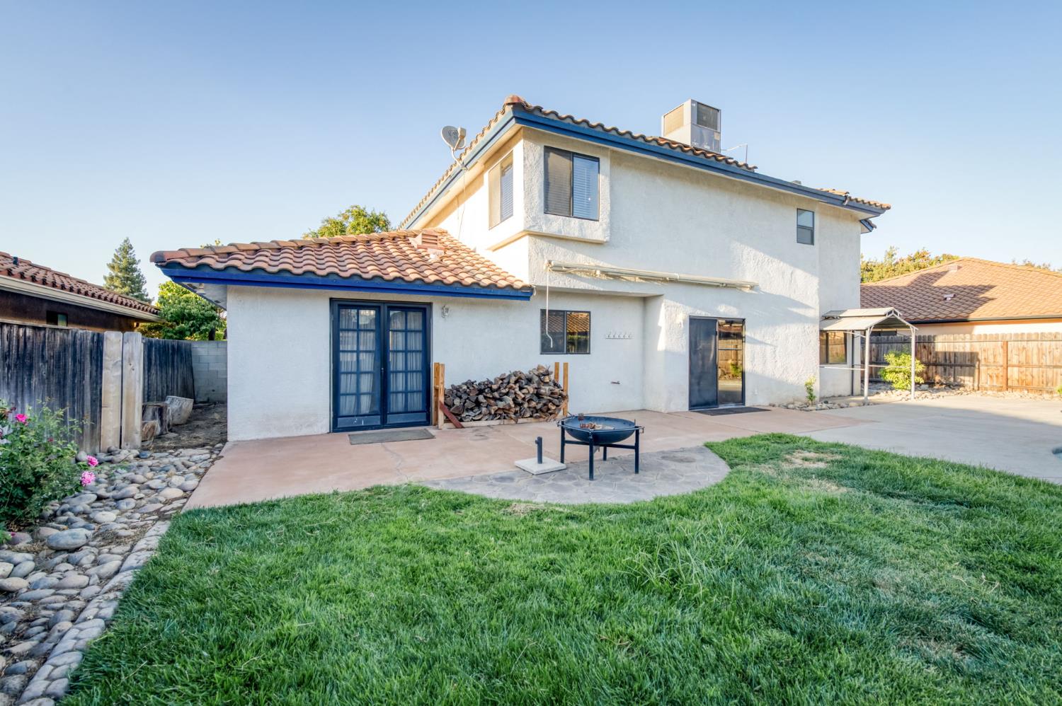 3040 Boulder Avenue Madera, CA 93637 - Photo 37 of 50 a view of a house with a yard and sitting area