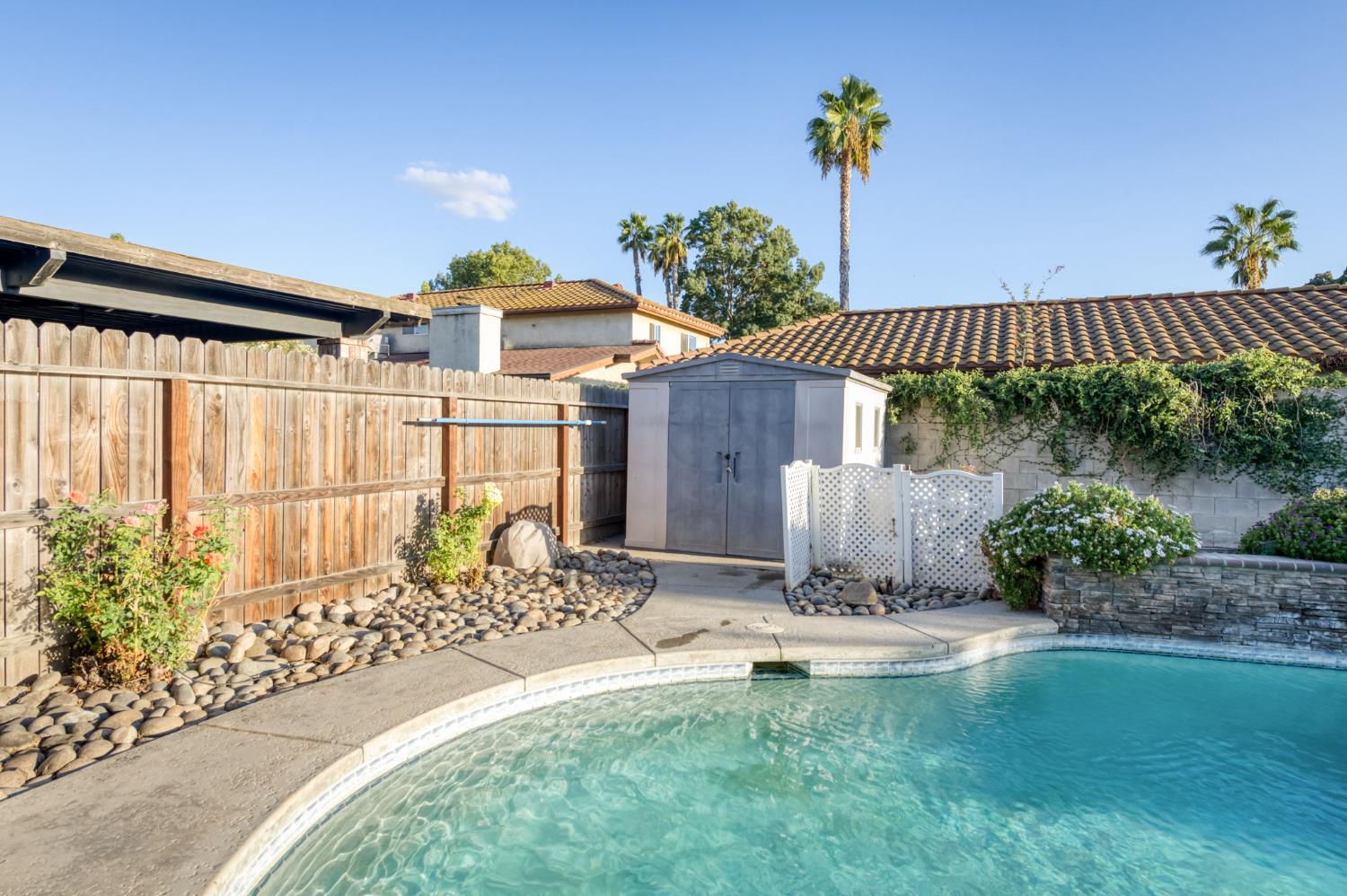 3040 Boulder Avenue Madera, CA 93637 - Photo 40 of 50 a front view of a house with a yard