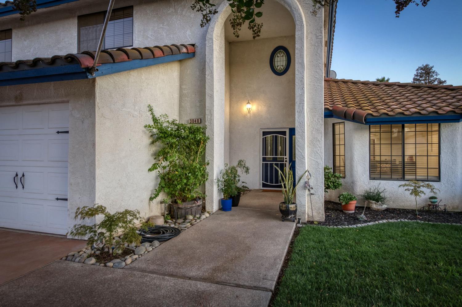 3040 Boulder Avenue Madera, CA 93637 - Photo 5 of 50 a view of a house with backyard and sitting area