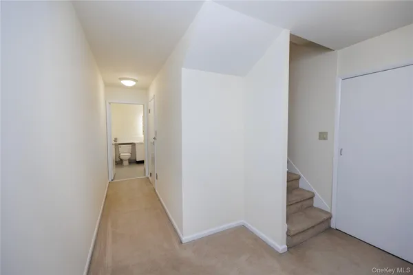 a view of a room with a hallway
