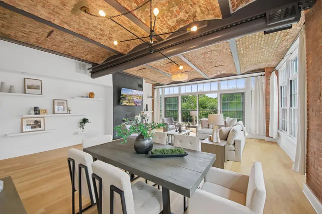 a dining room with furniture window and outside view