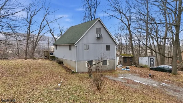 a view of a house with a yard covered in snow