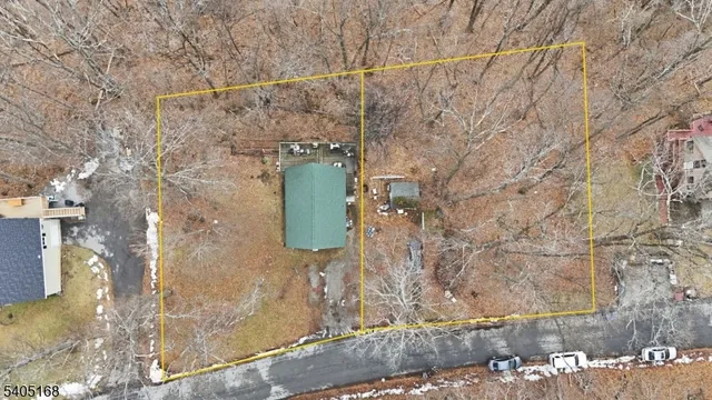 a view of a hallway with couch and chandelier