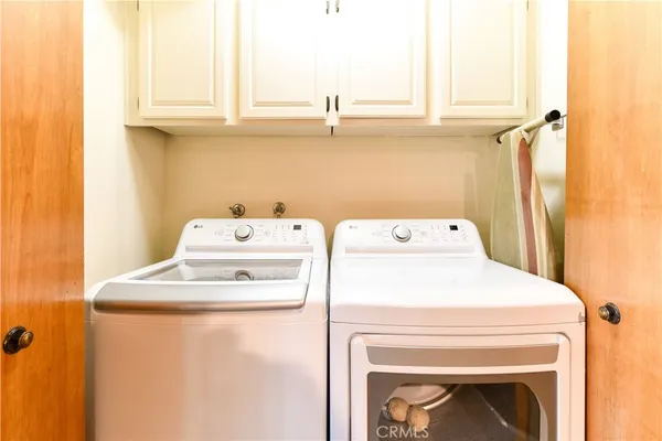 a en suite bathroom with a double vanity sink a mirror and a shower