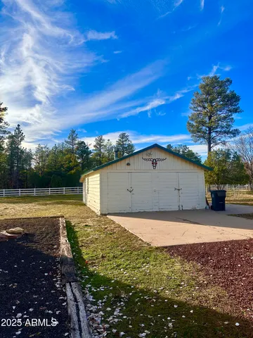 a view of a large yard with large trees