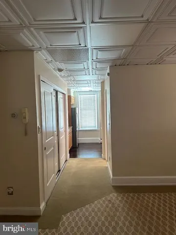 a view of a hallway with windows