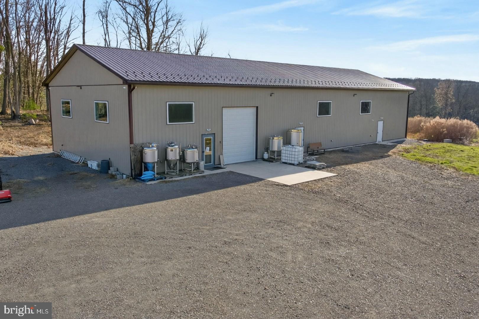 596 Harman Road Halifax, PA 17032 - Photo 11 of 34 a view of a house with backyard and sitting area