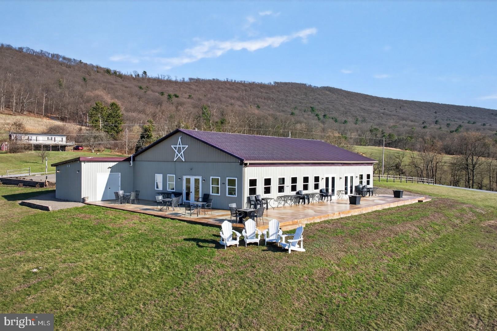 596 Harman Road Halifax, PA 17032 - Photo 4 of 34 a view of a house with a big yard and large trees