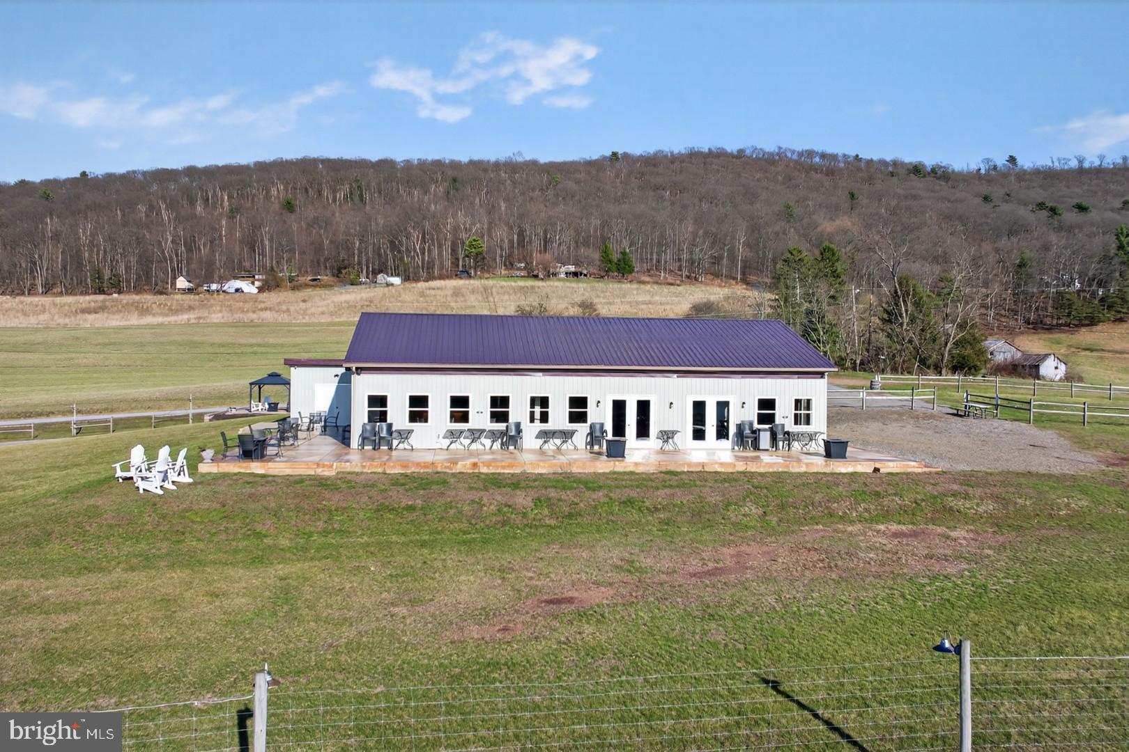 596 Harman Road Halifax, PA 17032 - Photo 5 of 34 a view of a big house with a big yard and large tree