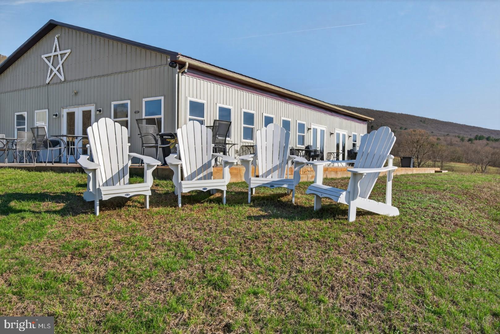 596 Harman Road Halifax, PA 17032 - Photo 7 of 34 a backyard of a house with table and chairs