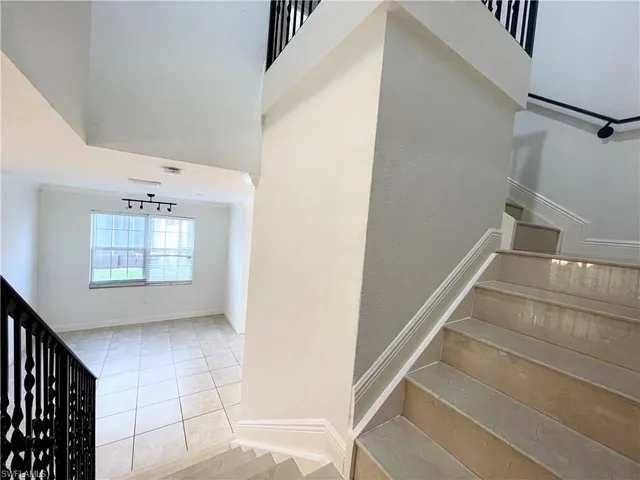 a view of entryway and hall with a window