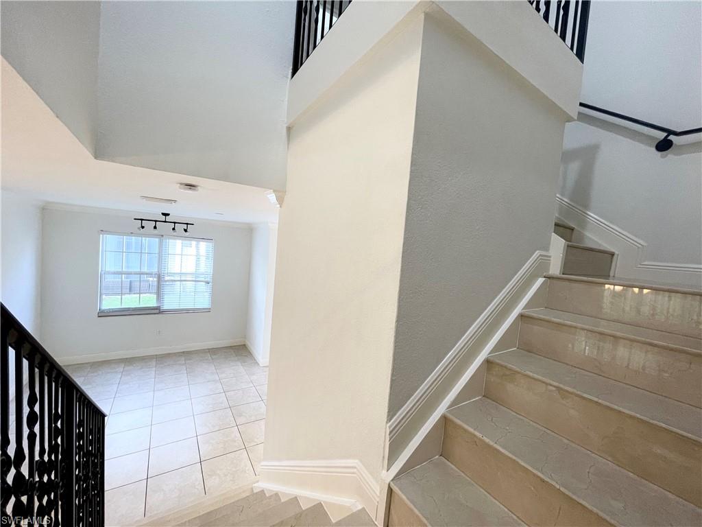 7051 Ambrosia Lane, Unit 3506 Naples, FL 34119 - Photo 18 of 23 a view of entryway and hall with a window