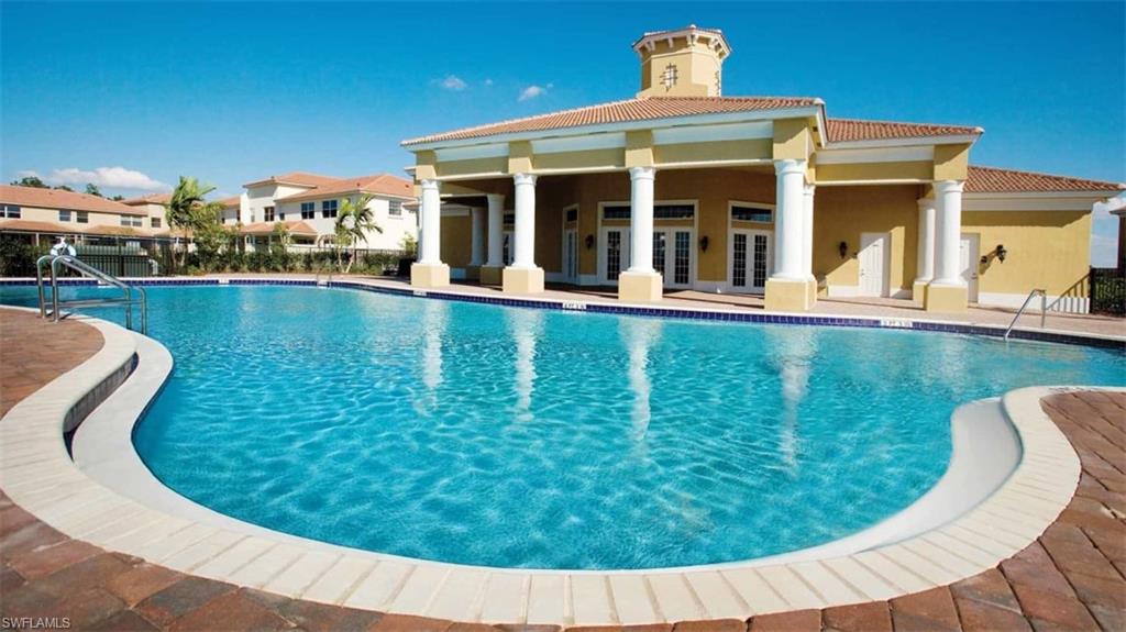 7051 Ambrosia Lane, Unit 3506 Naples, FL 34119 - Photo 2 of 23 a view of a house with swimming pool