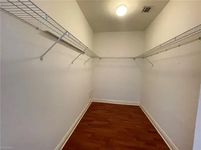 a view of a room with racks on the wall