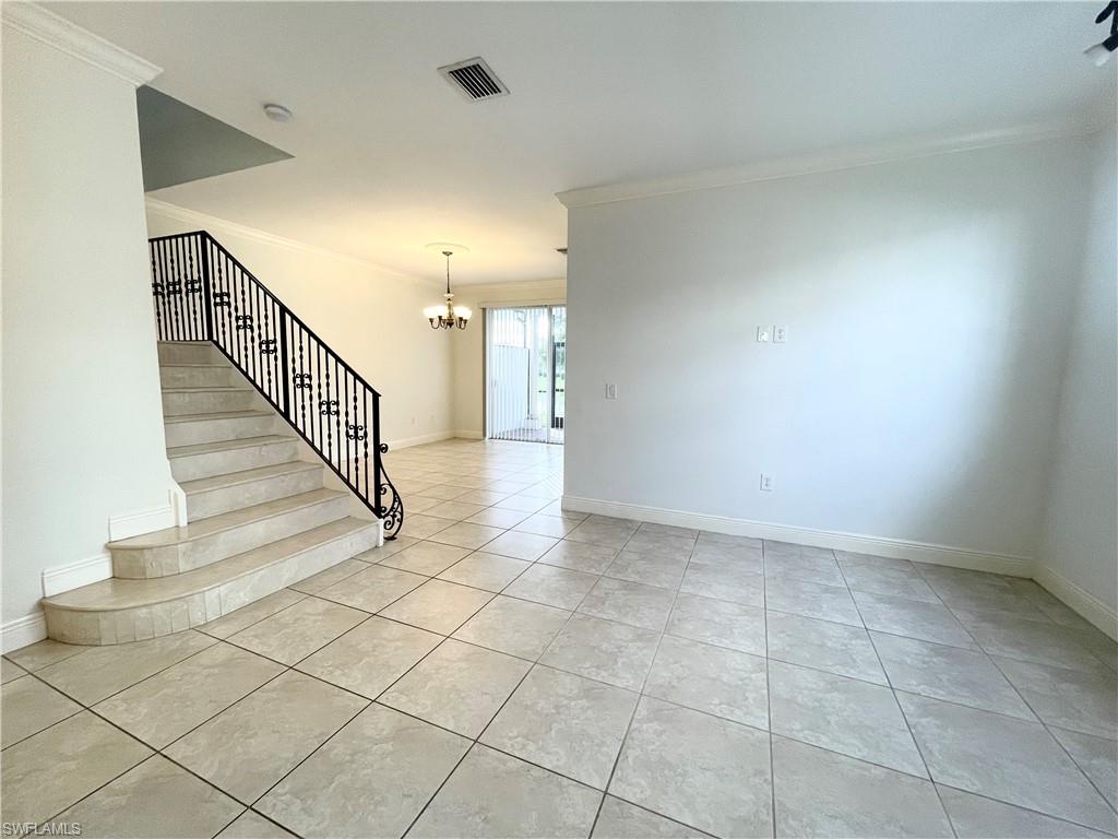 7051 Ambrosia Lane, Unit 3506 Naples, FL 34119 - Photo 6 of 23 a view of entryway and hall with a window
