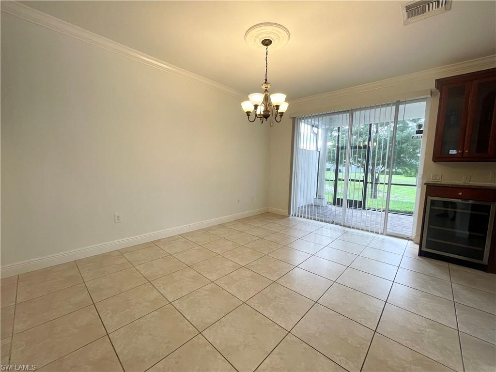 7051 Ambrosia Lane, Unit 3506 Naples, FL 34119 - Photo 7 of 23 a view of livingroom with kitchen island furniture