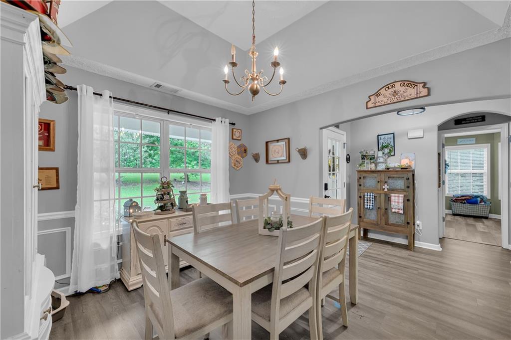 587-j B J B Owens Road Bethlehem, GA 30620 - Photo 22 of 99 a view of a dining room with furniture window and wooden floor