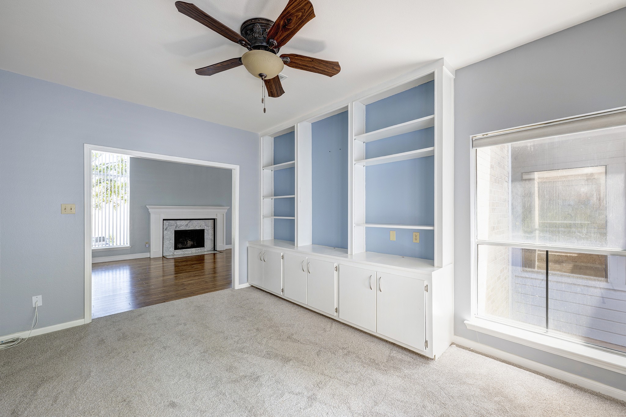 2601 South Broadway Street, Unit 29 La Porte, TX 77571 - Photo 13 of 37 a view of an empty room with a fireplace and a window