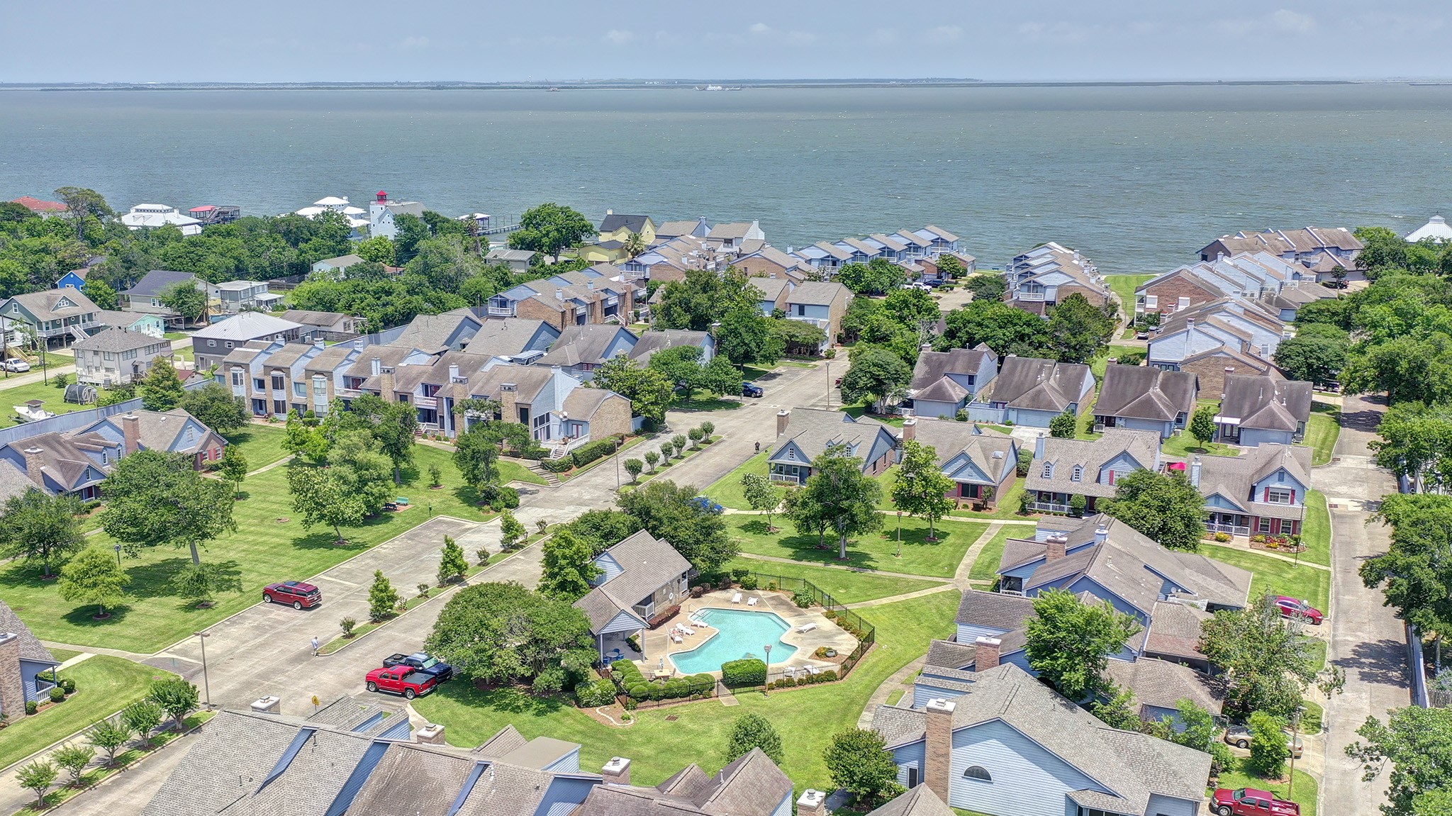 2601 South Broadway Street, Unit 29 La Porte, TX 77571 - Photo 17 of 37 This aerial view shows community pool and shared park-like green spaces.