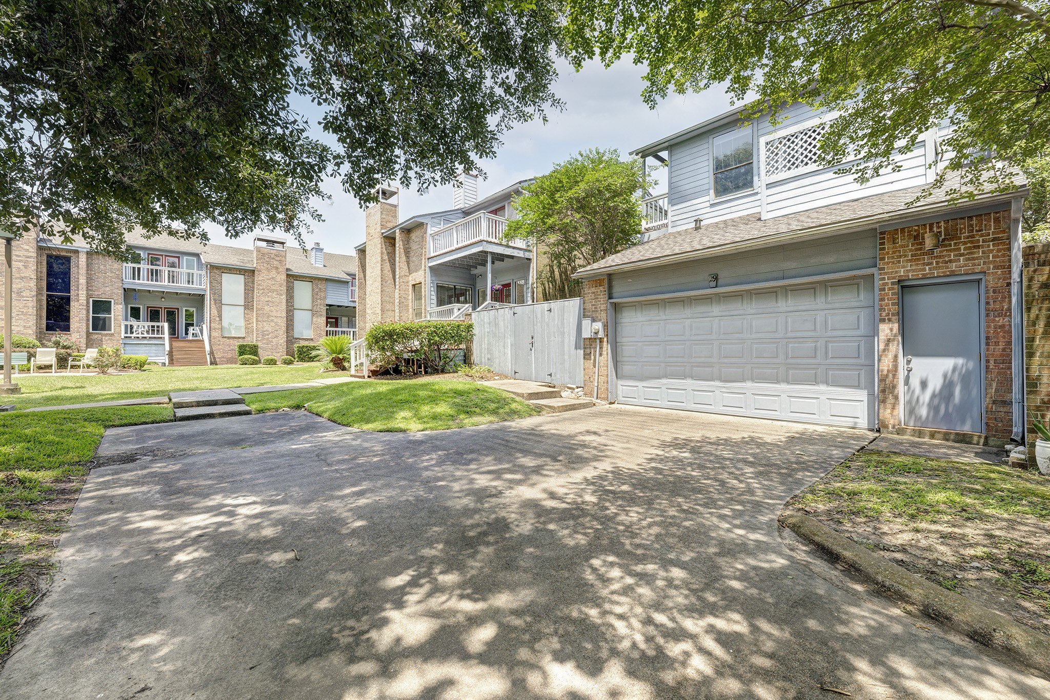 2601 South Broadway Street, Unit 29 La Porte, TX 77571 - Photo 4 of 37 a front view of a house with a yard and garage