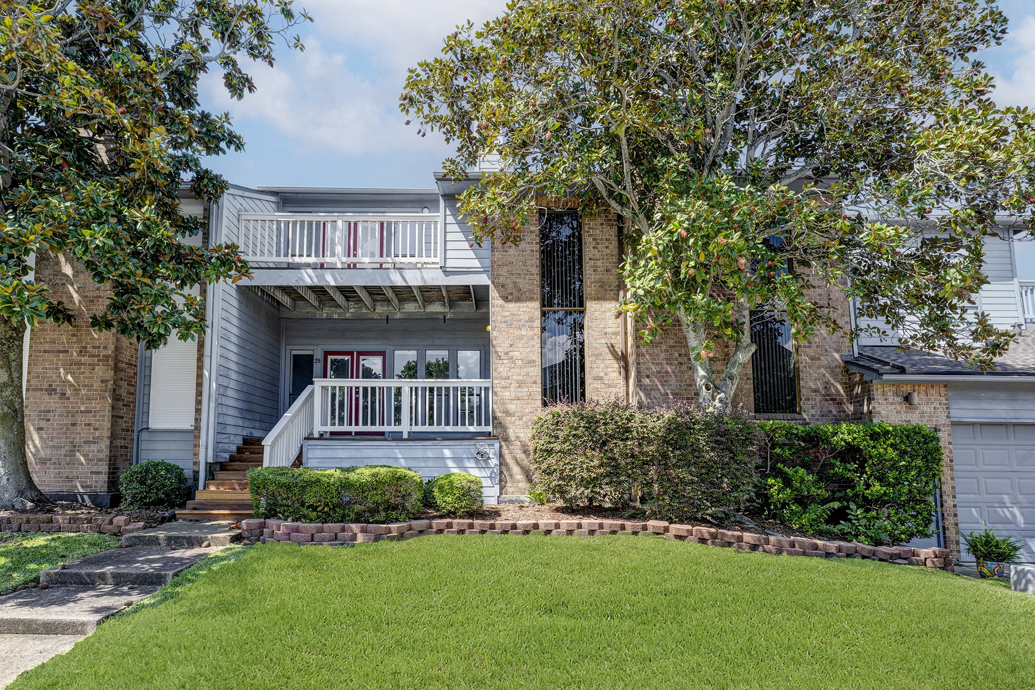 2601 South Broadway Street, Unit 29 La Porte, TX 77571 - Photo 5 of 37 Back side of town home with bay view from Primary Bedroom & back porch