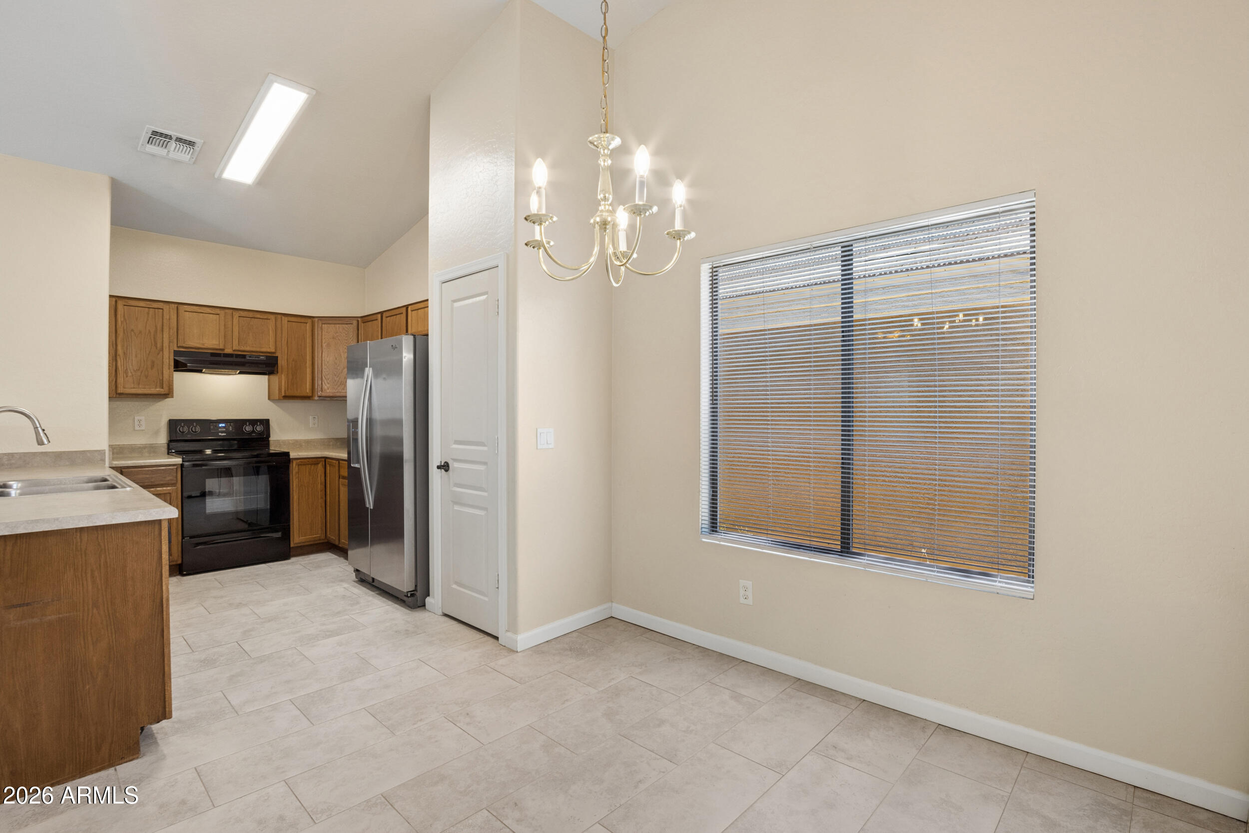 24025 West Pecan Road Buckeye, AZ 85326 - Photo 14 of 42 Dining Room looking towards Kitchen