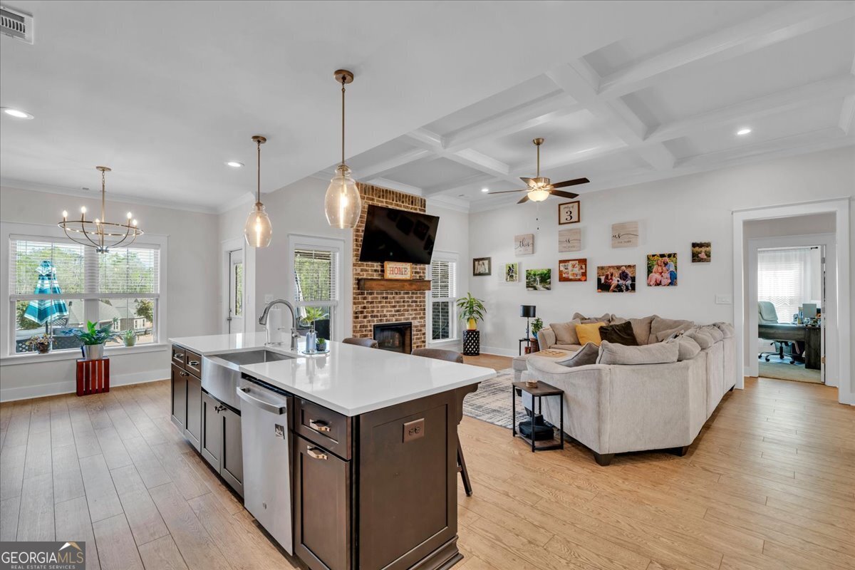 424 Rustic Live Oak Trail Bonaire, GA 31005 - Photo 12 of 51 a living room with furniture and a flat screen tv