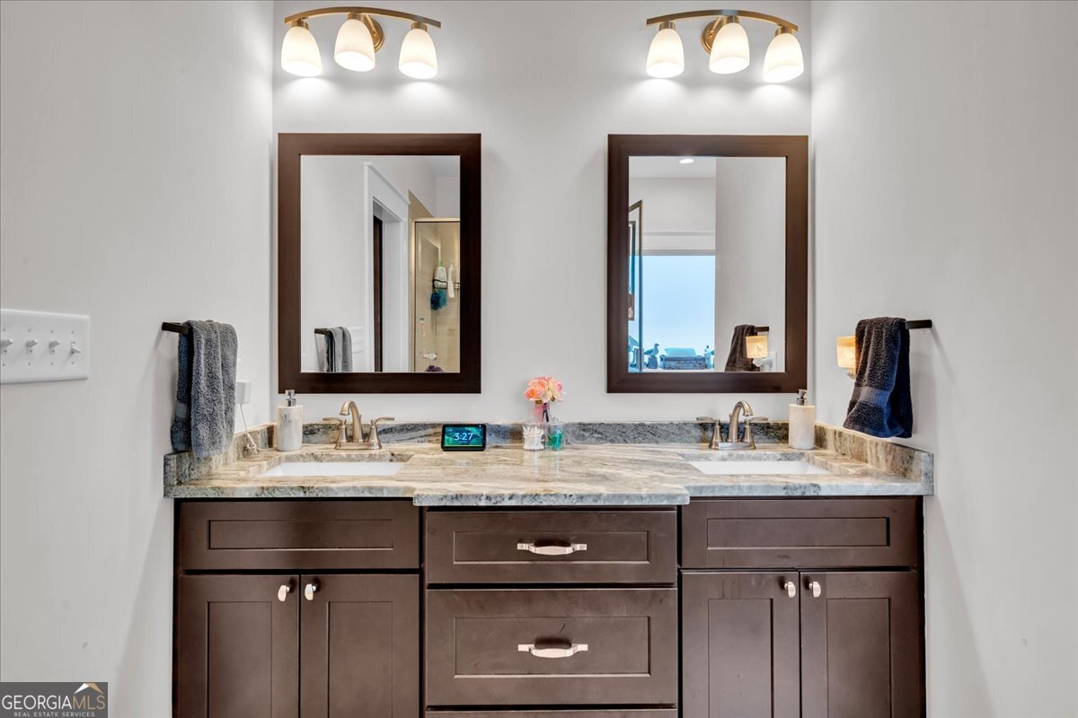 424 Rustic Live Oak Trail Bonaire, GA 31005 - Photo 26 of 51 a bathroom with a double vanity sink and a mirror