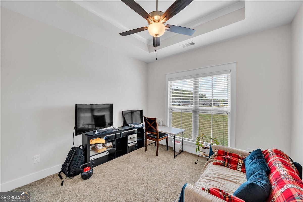 424 Rustic Live Oak Trail Bonaire, GA 31005 - Photo 27 of 51 a livingroom with workspace and a window