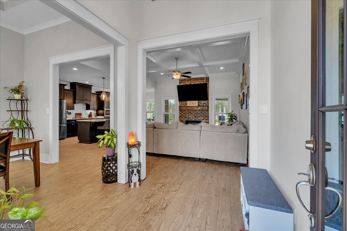 424 Rustic Live Oak Trail Bonaire, GA 31005 - Photo 34 of 51 a living room with furniture and flat screen tv
