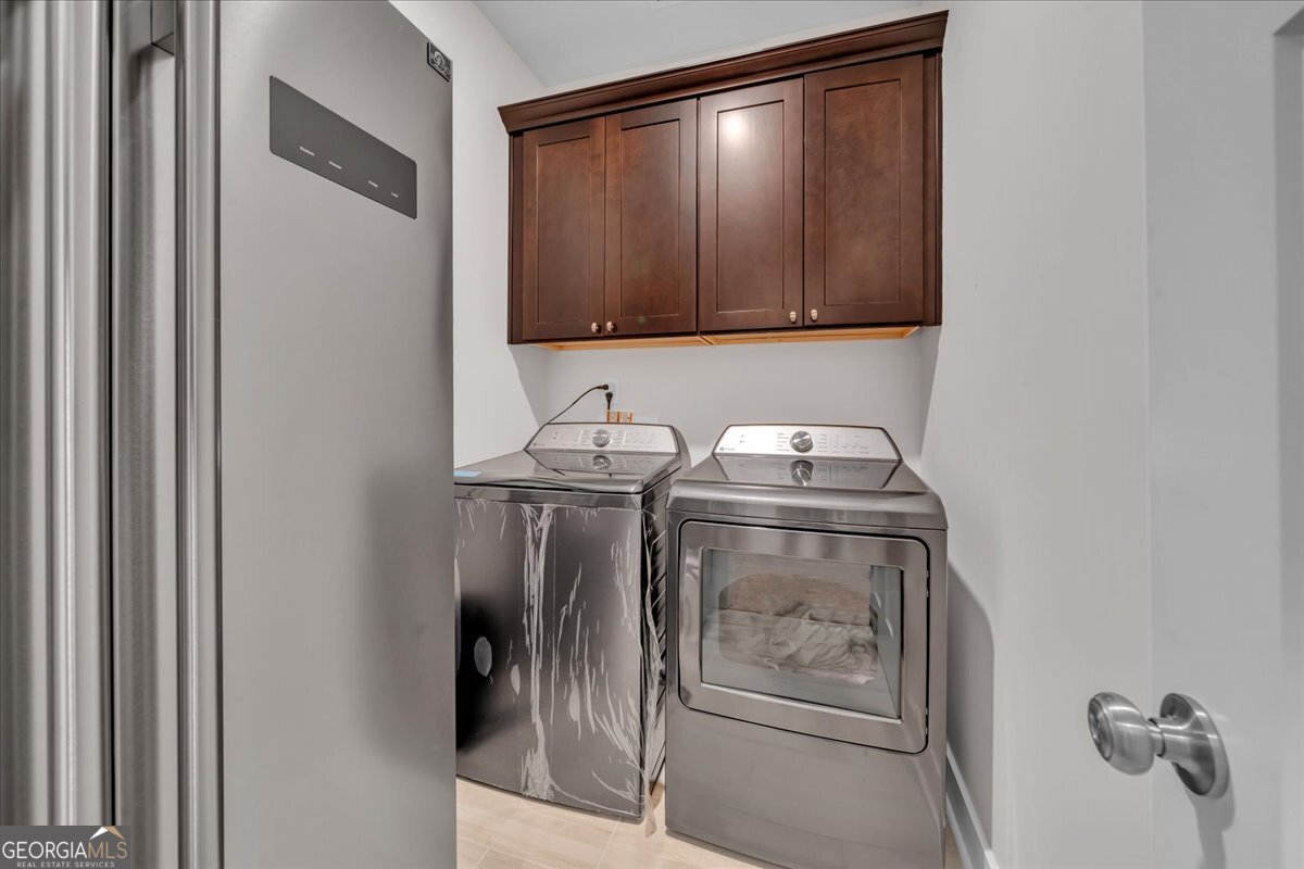 424 Rustic Live Oak Trail Bonaire, GA 31005 - Photo 35 of 51 a utility room with dryer and washer