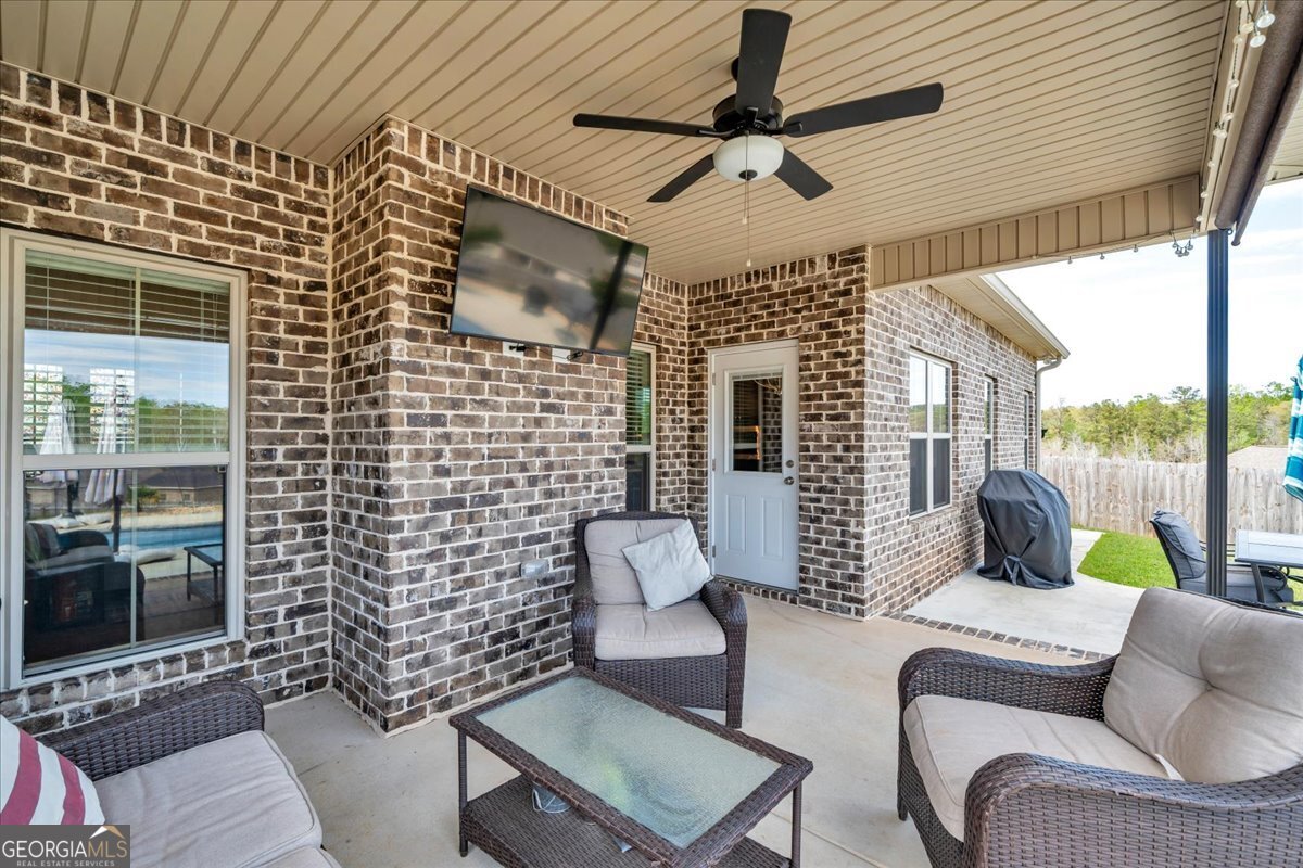 424 Rustic Live Oak Trail Bonaire, GA 31005 - Photo 37 of 51 a outdoor living space with patio furniture
