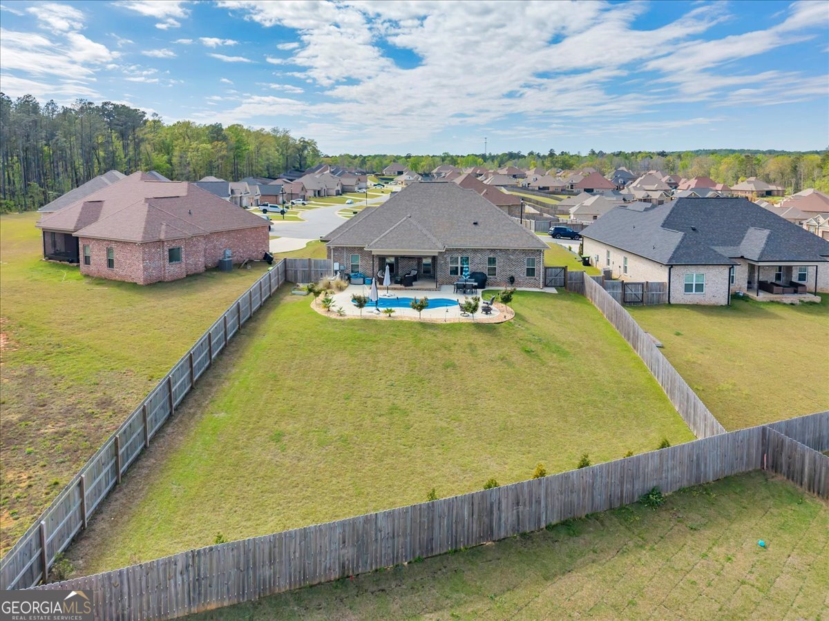 424 Rustic Live Oak Trail Bonaire, GA 31005 - Photo 45 of 51 a view of a swimming pool with a lake view