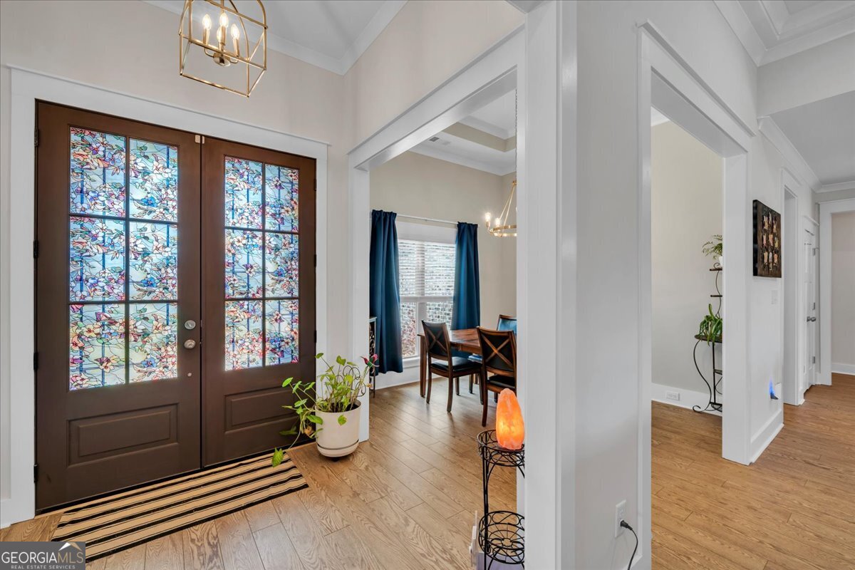 424 Rustic Live Oak Trail Bonaire, GA 31005 - Photo 6 of 51 a living room with furniture stove and wooden floor