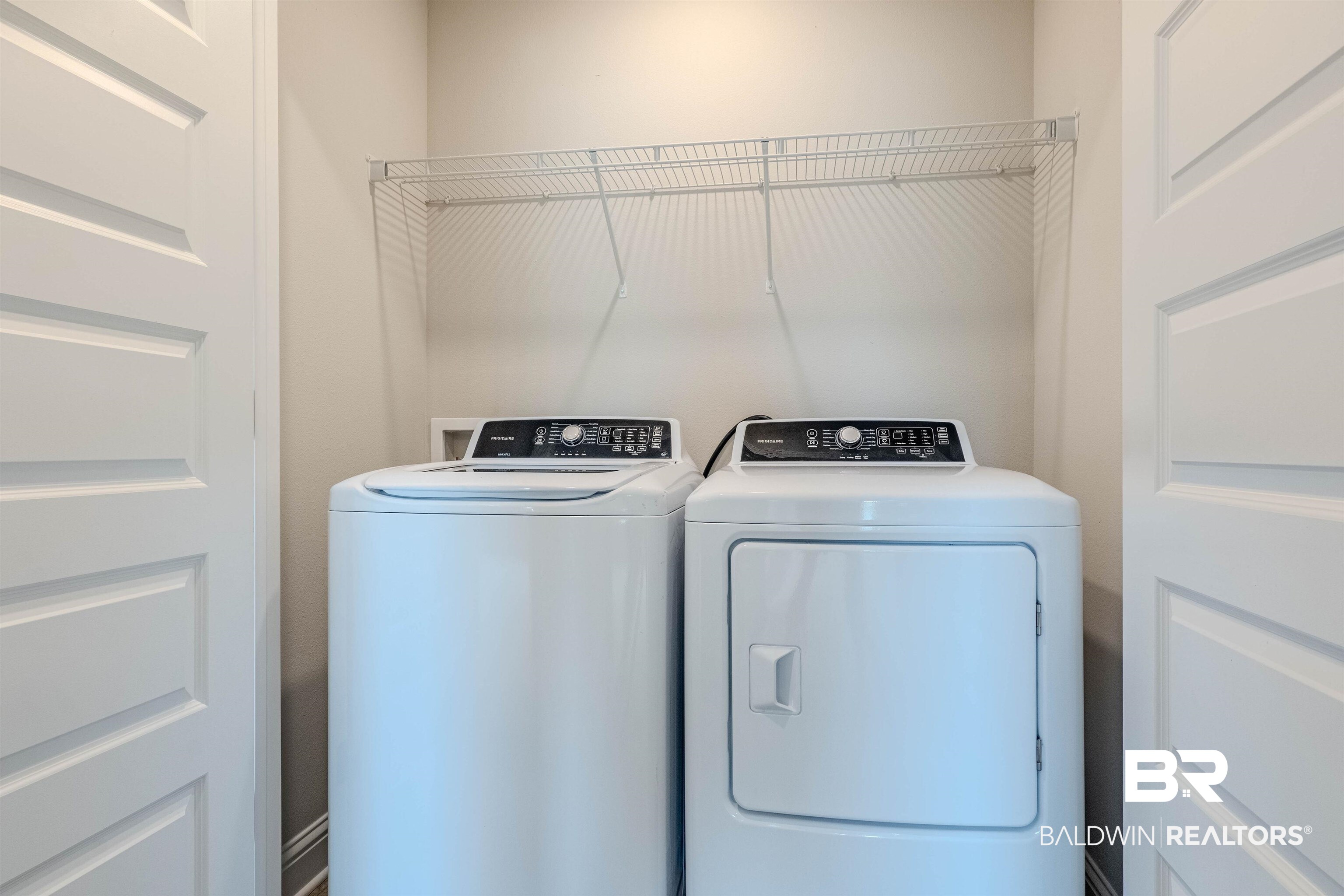 25806 Pollard Road, Unit 32 Daphne, AL 36526 - Photo 18 of 23 Clothes washing area featuring washing machine and clothes dryer