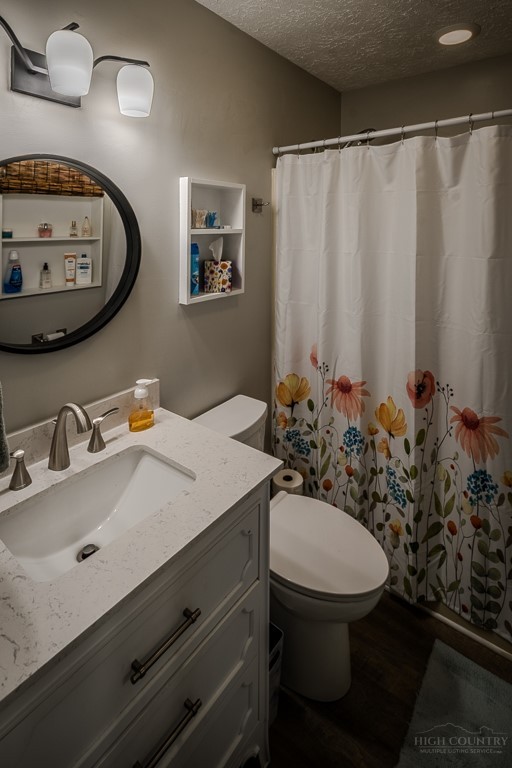 38 Rocky Meadows Road Newland, NC 28657 - Photo 16 of 50 a bathroom with a sink mirror vanity and toilet