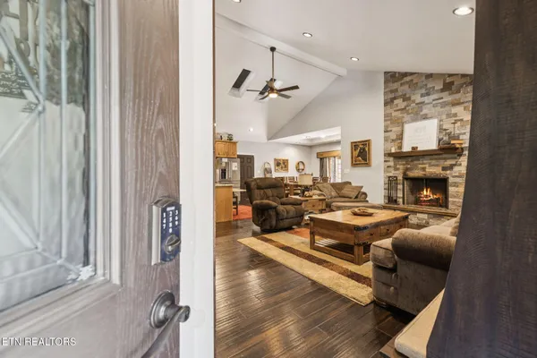 a living room with furniture and a fireplace