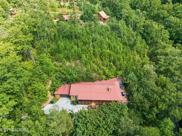 a view of a deck with wooden floor and fence
