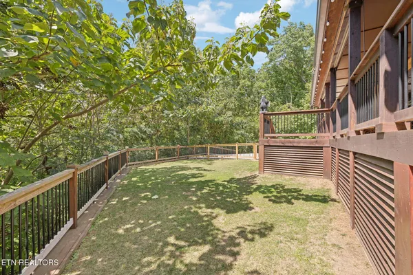 a view of a balcony with wooden floor