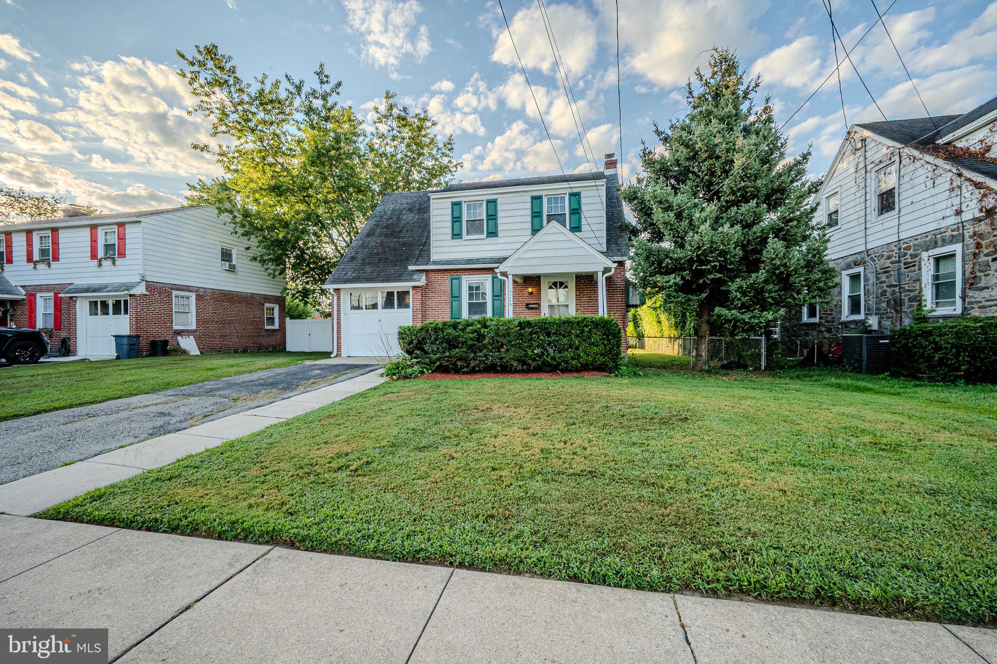624 Gilbert Road Ridley Park, PA 19078 - Photo 1 of 36 a front view of a house with a garden