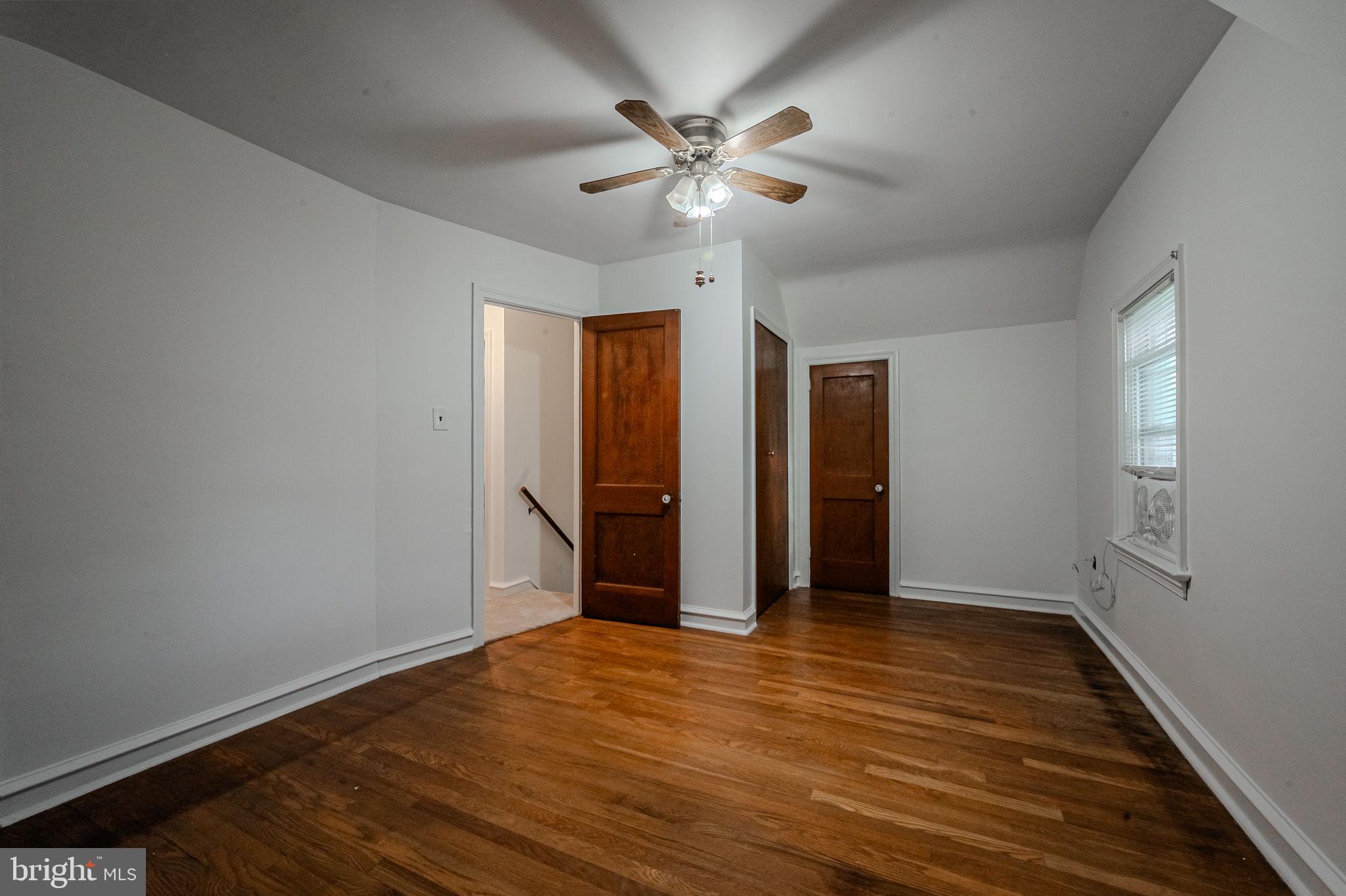 624 Gilbert Road Ridley Park, PA 19078 - Photo 17 of 36 wooden floor in an empty room with a window